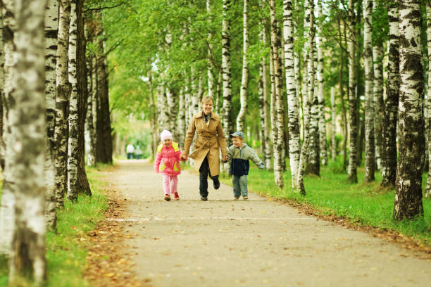 istock Mother and children having fun in the park 92701218