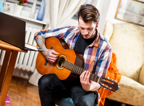 istock Young man musician, indoor. 927012458