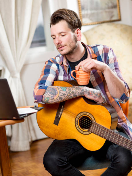 istock Young man musician, indoor. 927012674
