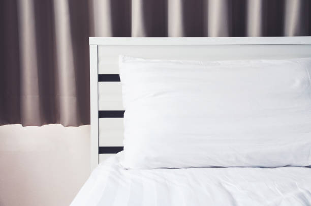 istock quilt bed  white pillows on white bed in bedroom 927015772