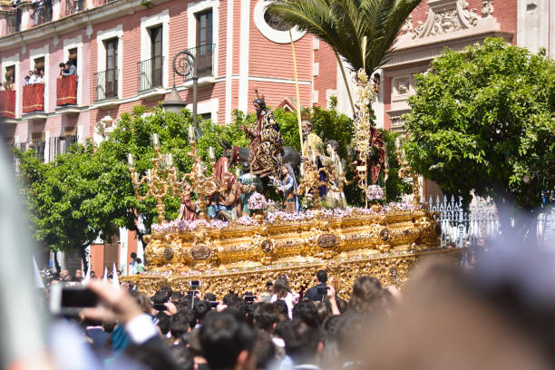 Jesus Christ carried on shoulder in the processions The beautiful Seville in Andalucia Spain, between traditions and architectural beauties holy week photos stock pictures, royalty-free photos & images