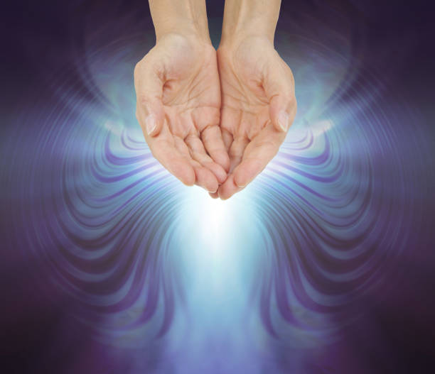 istock Hands Bathed in a Resonating Quantum Healing Energy Field 927023778