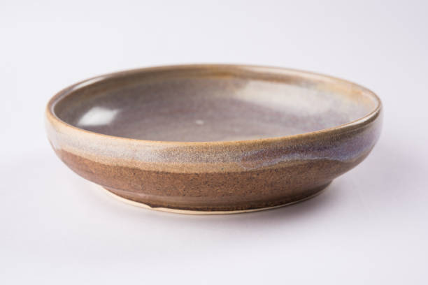 istock Empty brown ceramic serving bowl, isolated over white or gray background 927027720
