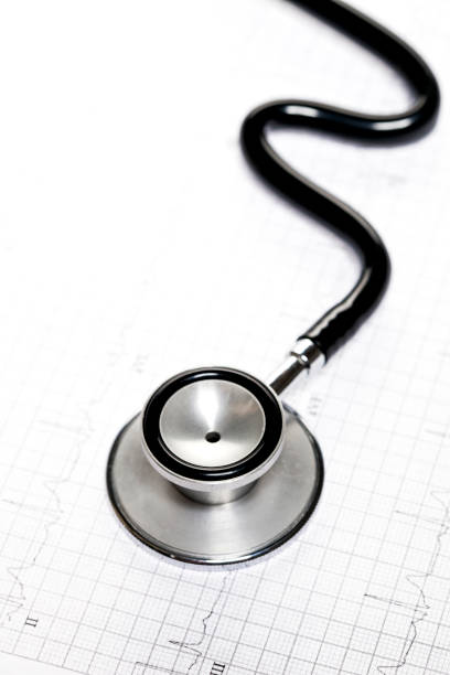 istock Stethoscope in shape of heart beat on electrocardiogram. 927031976