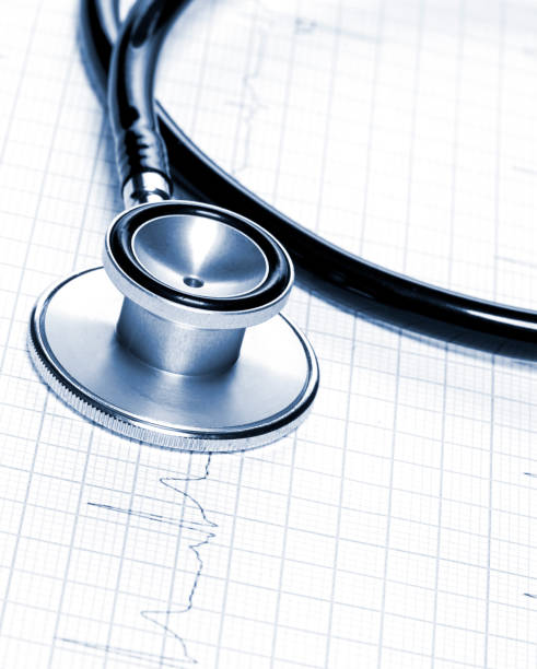 istock Stethoscope in shape of heart beat on electrocardiogram. 927032422