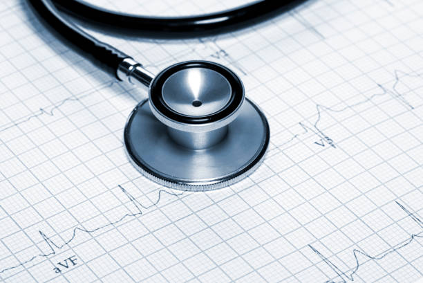 istock Stethoscope in shape of heart beat on electrocardiogram. 927032428