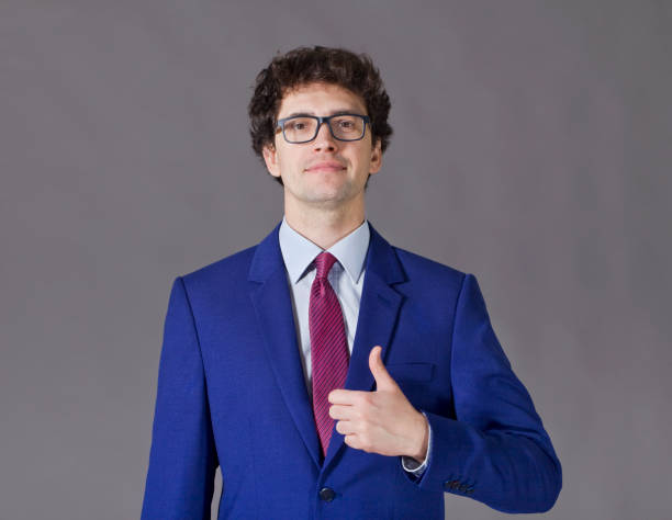 istock Nice boy smiling and showing big thumbs up 927038650