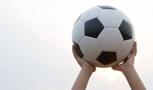 istock football on sand broken 927039806