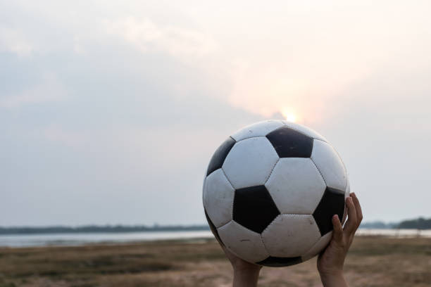 istock football on sand broken 927039894