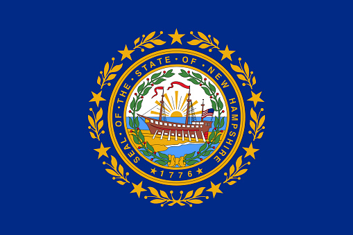 The Vermont state flag waving along with the national flag of the United States of America. Vermont is a state in the New England region of the United States