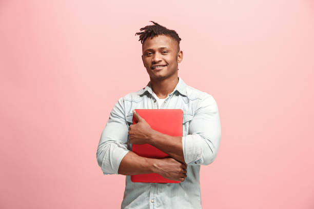 istock Afro-American Businessman hugging laptop 927046578