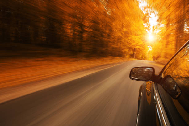 istock Car on the autumn road 927047252