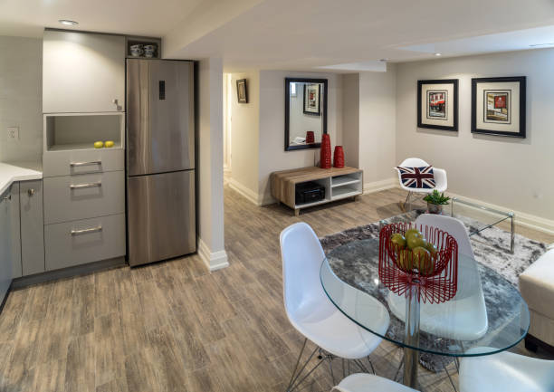 Toronto, Ontario - March 1, 208. Interior of modern urban residence in basement of the family home, with  dinning room, common area  and the view of the kitchen.
