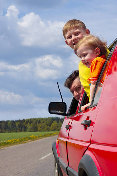 istock children with father in car 92705049
