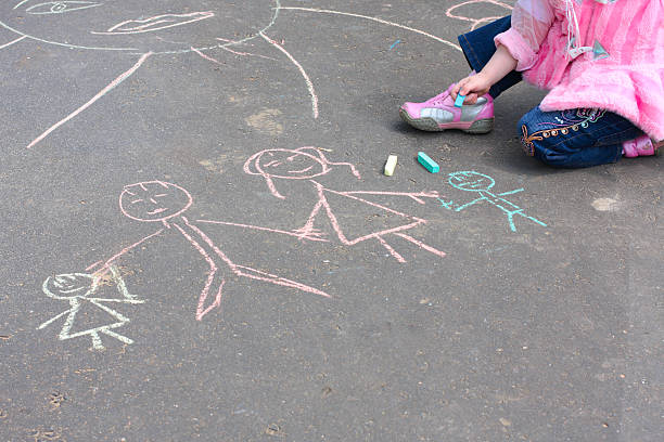 istock girl with  chalk on asphalt 92705207