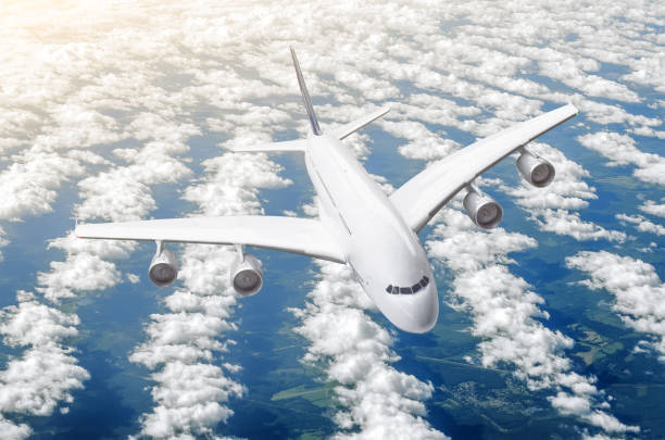 istock Passenger huge liner plane fly on a fly above clouds and blue sky. 927056852