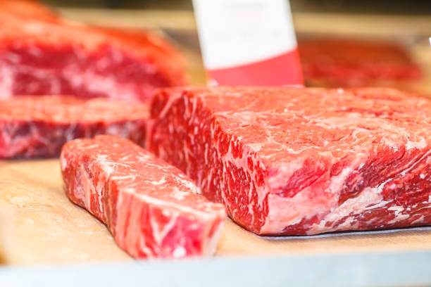 istock Marble beef steak strip loin is on the counter 927057214