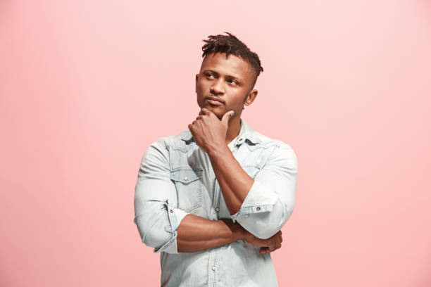 istock Young serious thoughtful Afro-American businessman. Doubt concept 927057776