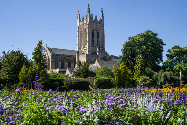 St Edmundsbury Cathedral in Bury St. Edmunds, Suffolk, UK A view of the beautiful flowers in Abbey Gardens and the historic St. Edmundsbury Cathedral in Bury St. Edmunds, Suffolk. bury st edmunds photos stock pictures, royalty-free photos & images