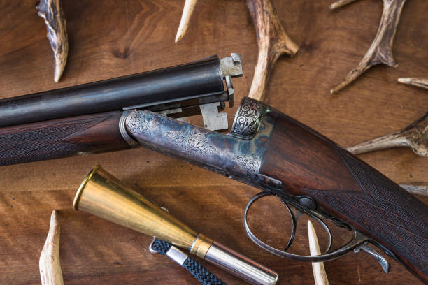istock beautiful hunting rifle and deer antlers 927062776