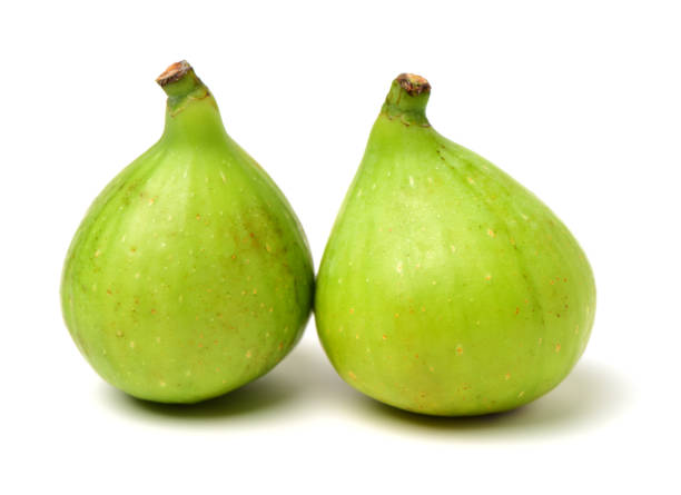 istock Bisected and whole fig fruit isolated on white 927065220