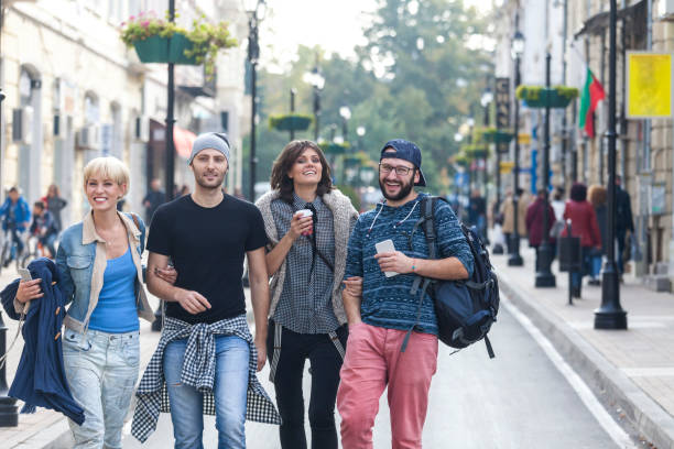 istock Friends walking on street 927072788