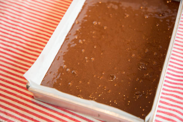 istock Close up Home Made brownie in cake tin.(selective Focus) 927074040