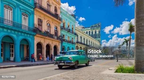 Cityscape With American Green Vintage Car On The Main Street In Havana City Cuba Serie Cuba Reportage Stock Photo - Download Image Now