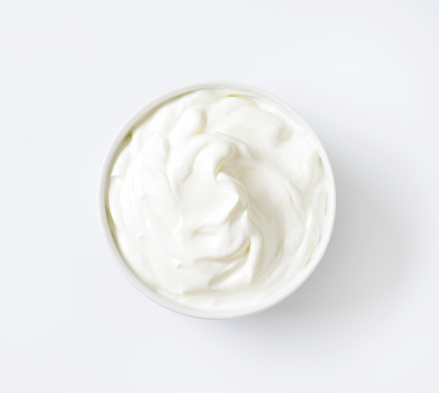 bowl of white cream on white background