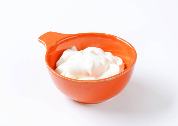 bowl of white cream on white background