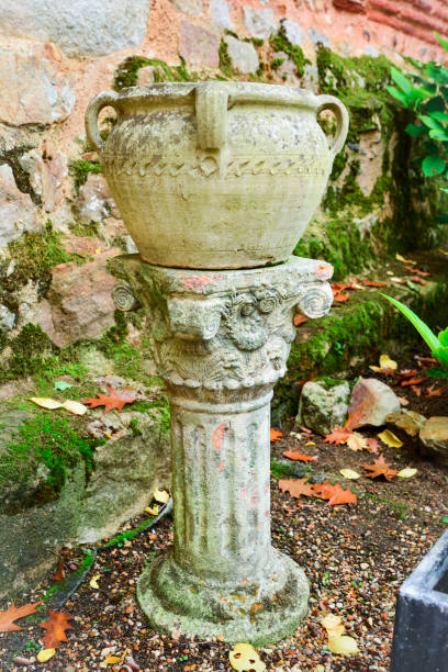 istock Ancient Roman column and stone vessel 927079704
