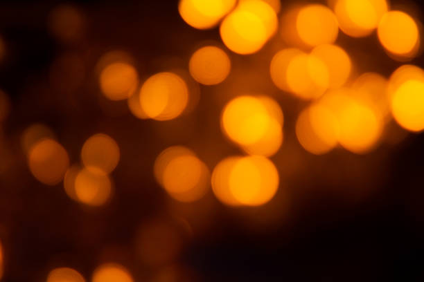 istock Defocused of light blue and orange led light on black background. 927080384