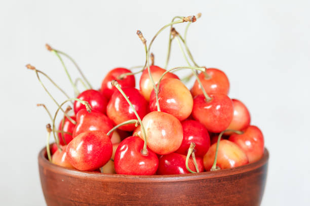 istock White cherry close-up in clay plate 927084340