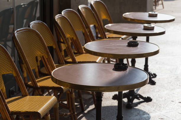 istock Row of cafe chairs and tables outside on terrace 927087626