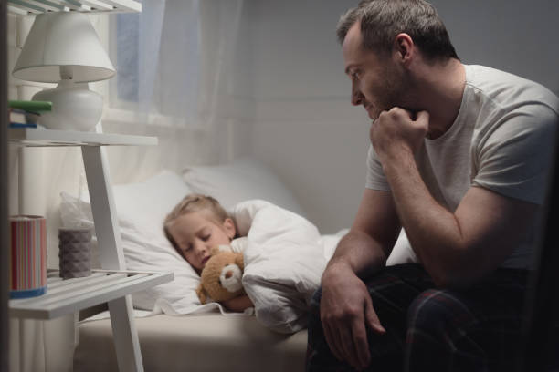 istock father and daughter at bedtime 927091524