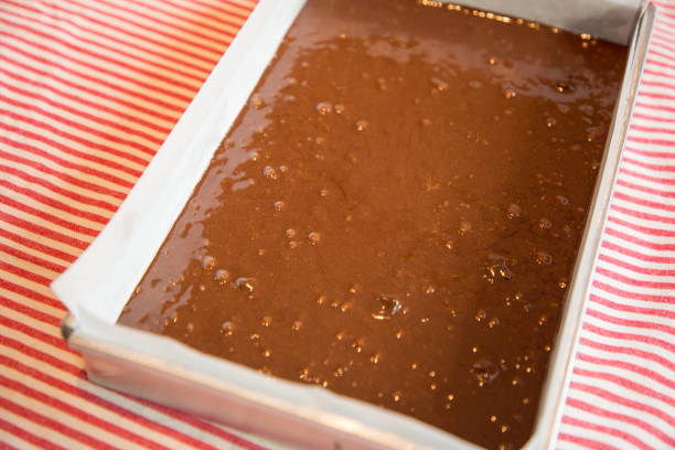 istock Close up Home Made brownie in cake tin.(selective Focus) 927094144