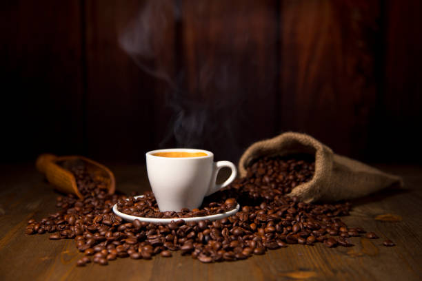 istock A Espresso Coffee Cup with smoke Beans and Jute Bag 927096394