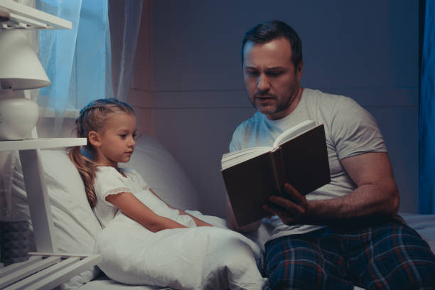 istock family reading book at bedtime 927096416