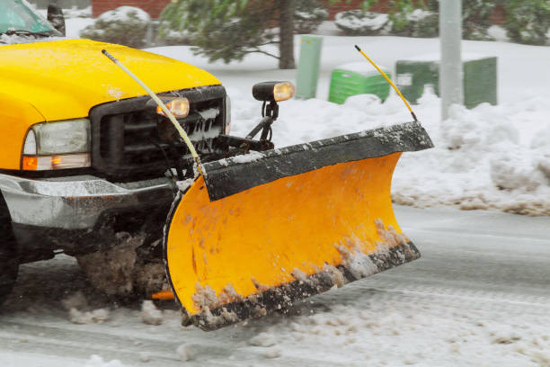 istock Snow plow cleaning snow from city road 927096564