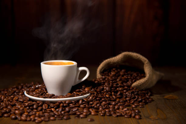 istock A Espresso Coffee Cup with smoke Beans and Jute Bag 927096718