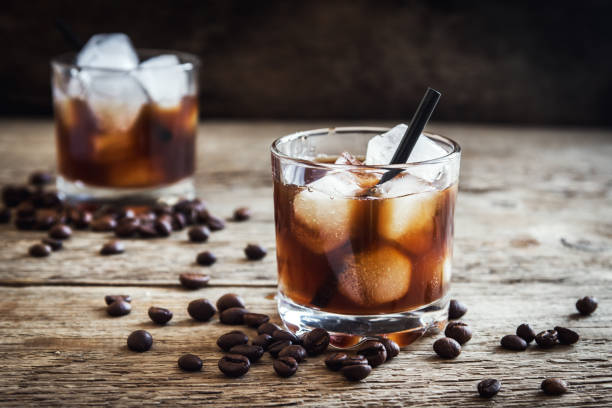 Black Russian Cocktail Black Russian Cocktail with Vodka and Coffee Liquor. Homemade Alcoholic Boozy Black Russian drink with coffee beans on wooden background with copy space. Kahlua stock pictures, royalty-free photos & images