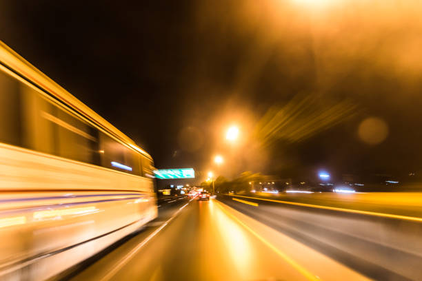 istock Motion blur steet light. Fast cars on highway in evening light 927120718