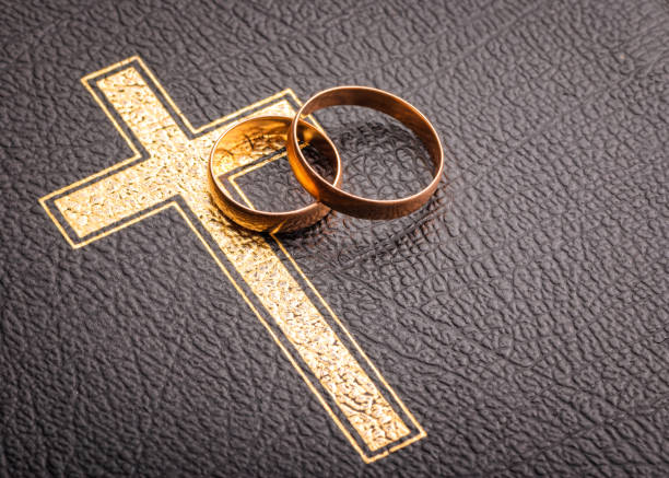 istock wedding rings on the bible 927125454
