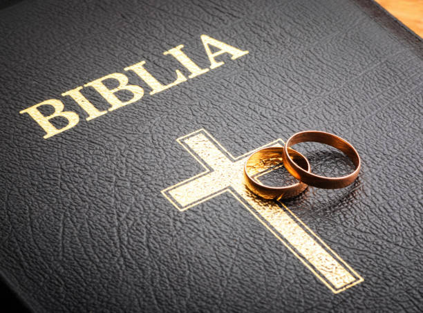 istock wedding rings on the bible 927125496