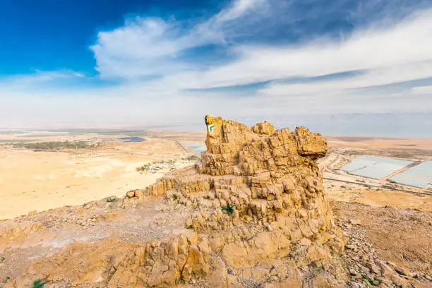 Desert rock cliff Dead sea landscape scenic view, Qumran ruins tourism destination, travel Israel.