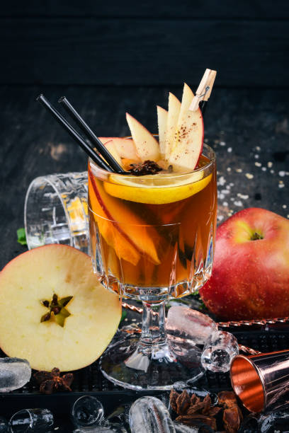 istock Cocktail Old Tom. Whiskey. On a black wooden background. 927135386
