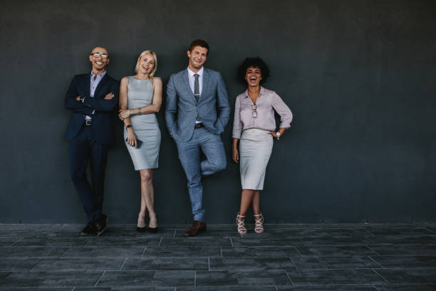 istock Multi-ethnic group of laughing business people 927136112