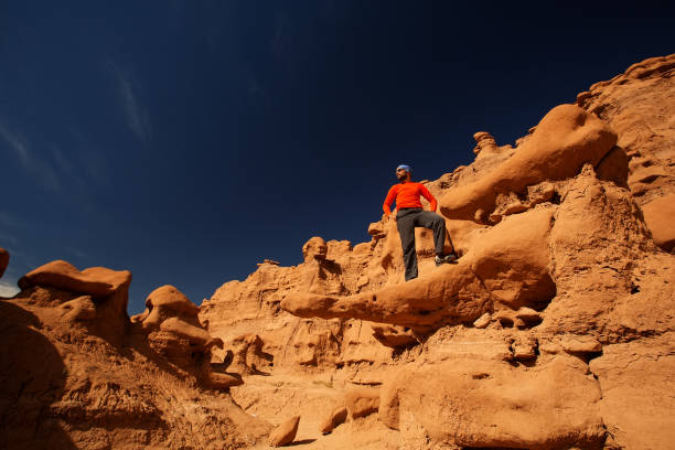 istock Hiker in Goblin valley State park in Utah, USA 927141998