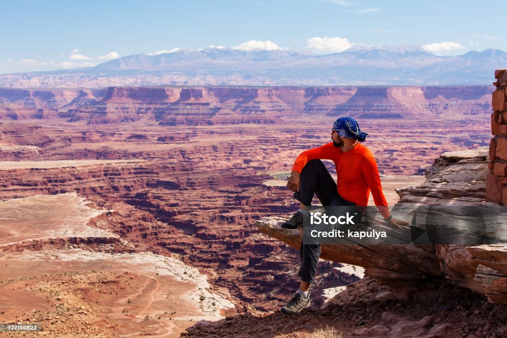 Hiker rests in Canyonlands National park in Utah, USA Hiking Stock Photo