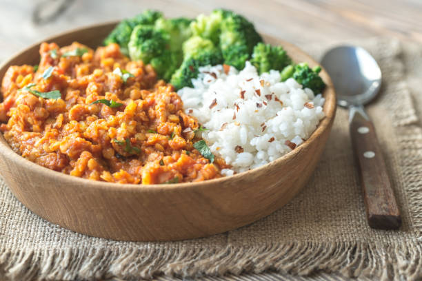 istock Bowl of red lentil curry with white rice and broccoli 927161956